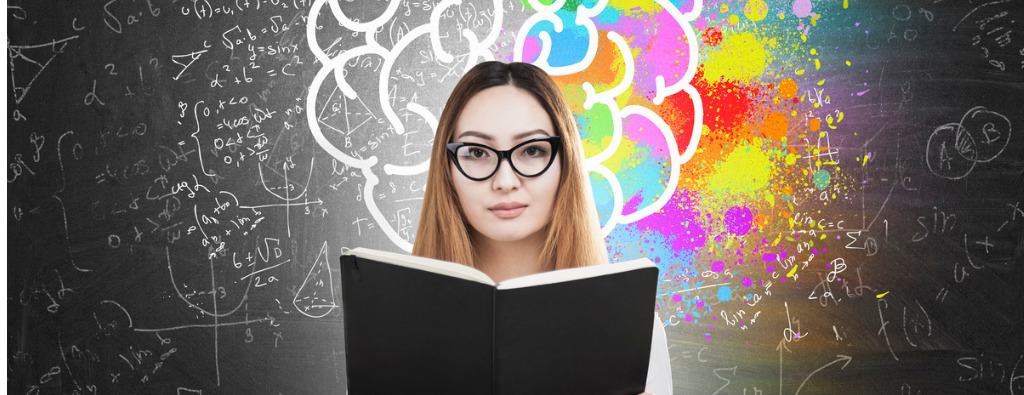 Woman with glasses reading a black book with a colorful dark background making references to creativity, wellness, sustainable well-being services provided by public speaker Lisa Cypers Kamen