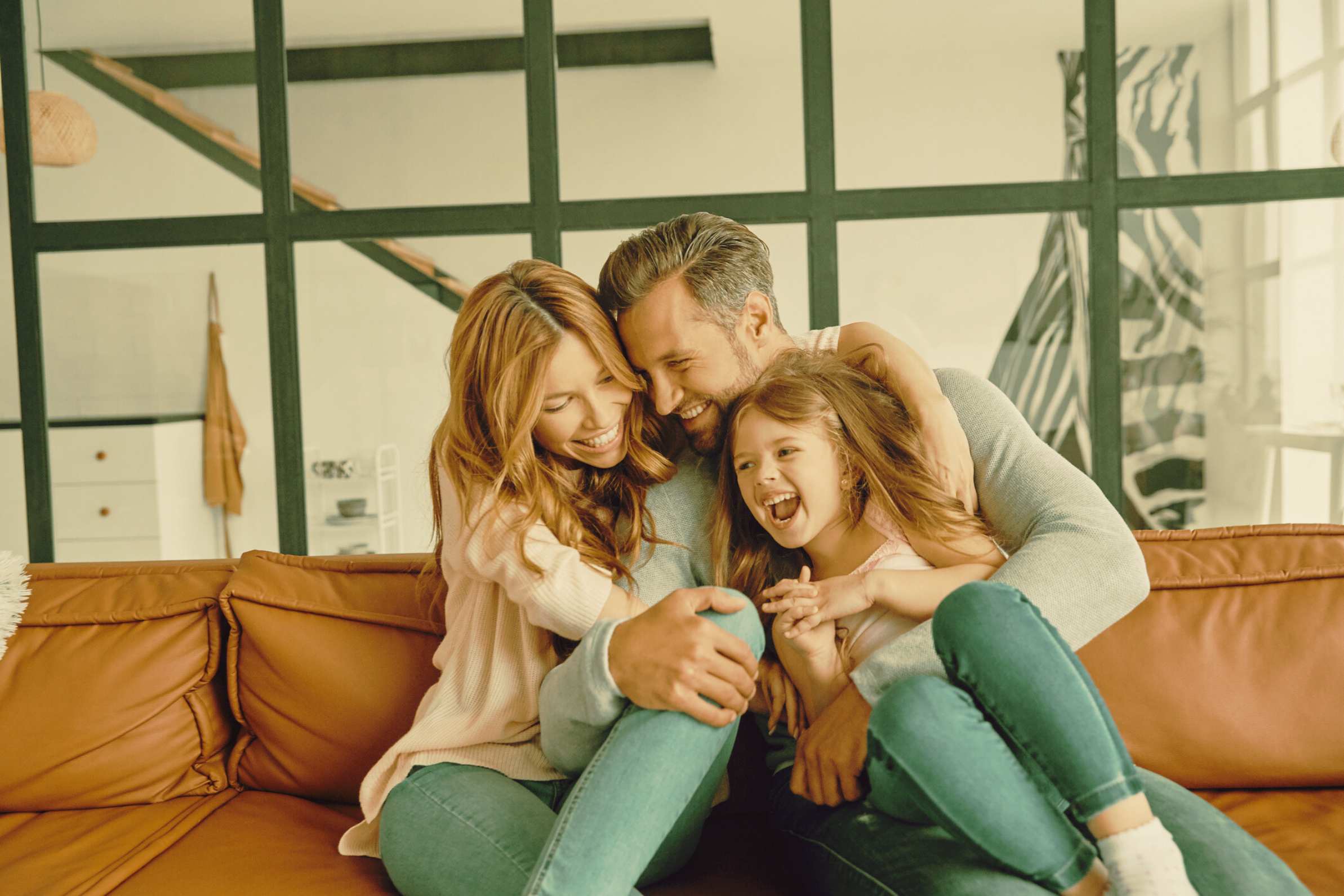 Family smiling in a happier home